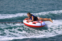 AIRHEAD Hot Shot in-water action with rider getting air time for thrilling performance