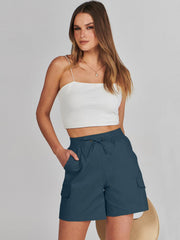 ANRABESS side profile on model demonstrates mid-thigh length and relaxed movement