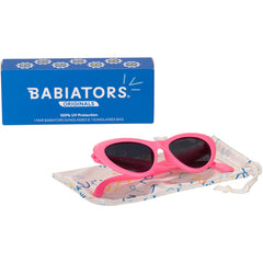Babiators on baby in stroller showing comfortable secure fit outdoors
