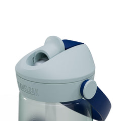 CamelBak Thrive next to backpack showing compact 25oz capacity portability