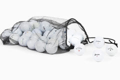 Clean Green Golf Balls held in hand for size comparison and practical scale