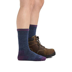 Darn Tough sock worn inside a work boot demonstrating fit and protection