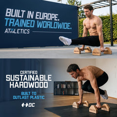 DC Athletics in-use demonstrating push-up form with wrist-friendly wooden handles for control
