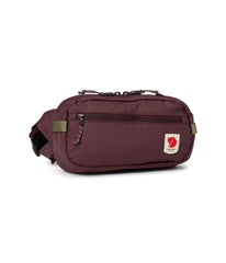 Fjällräven High Coast hip pack front view in blackberry showing compact profile and zippered pockets for secure storage