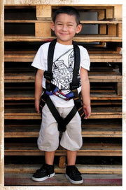 Fusion front view of orange kids harness showing secure layout and visibility benefit
