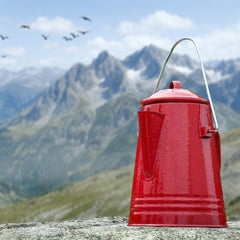 GRIP percolator perched over campfire demonstrating stable outdoor brewing