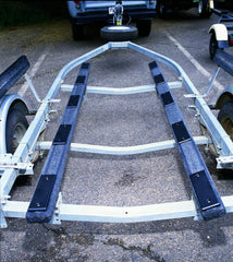 Ironwood Pacific E-Z Slide in use at boat ramp showing smoother loading and unloading