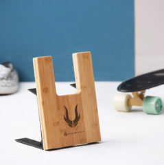 J JACKCUBE DESIGN skateboard inserted in stand protects walls and floors