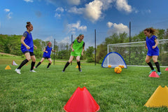 Kwik Goal cones arranged for agility drill on turf showing clear field definition