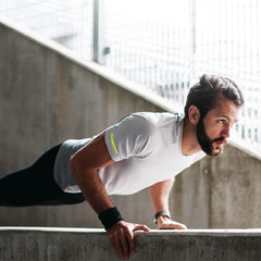 Men's Health open spread showing daily workout layout and clean checklist to stay consistent
