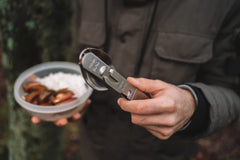 Militar cutlery held in hand for scale and easy-to-carry everyday benefit