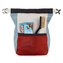 Oso Supply Co bucket on bouldering crash pad in use with climber re-chalking hands for quick attempts
