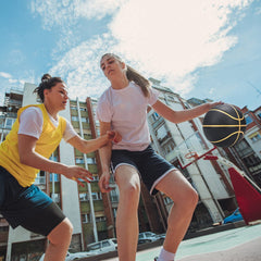 PECOGO ball in hand showing size 6 scale for youth and adult training