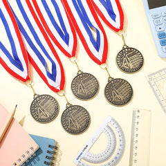 Quelay group of multiple medals laid out showing ample quantity for events