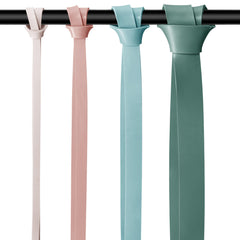 Retrospec Lift bands in use during a pull-up demonstrating assisted strength training