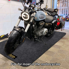 Roykaw mat under motorcycle protecting garage floor from oil and drips