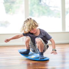 Spooner Boards Freestyle blue in use with child practicing balance and coordination