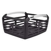 Thule Pack 'n Pedal basket front view showing storage capacity and sleek black finish