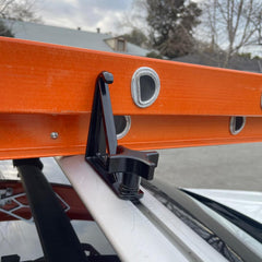 Timilge side view of load stop installed on crossbar demonstrating secure rail locking