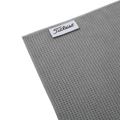 Titleist towel clipped to a golf bag demonstrating portability and easy access benefit