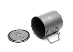 TOAKS close detail of folding handle showing secure grip and space-saving benefit