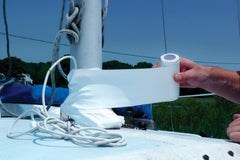 Tommy Tape installed on a keel-stepped mast in harbor showing watertight seal and neat finish