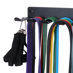 Topsair rack with jump ropes and lifting belts hanging neatly, reducing floor clutter