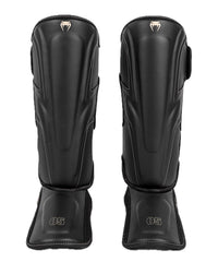 Venum Impact Evo front view showing full shin coverage and sleek protection