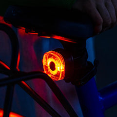 woom light mounted on handlebar while child rides demonstrating clear illumination