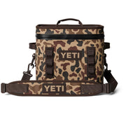 YETI Hopper Flip 12 front view showing compact carry and rugged camo finish