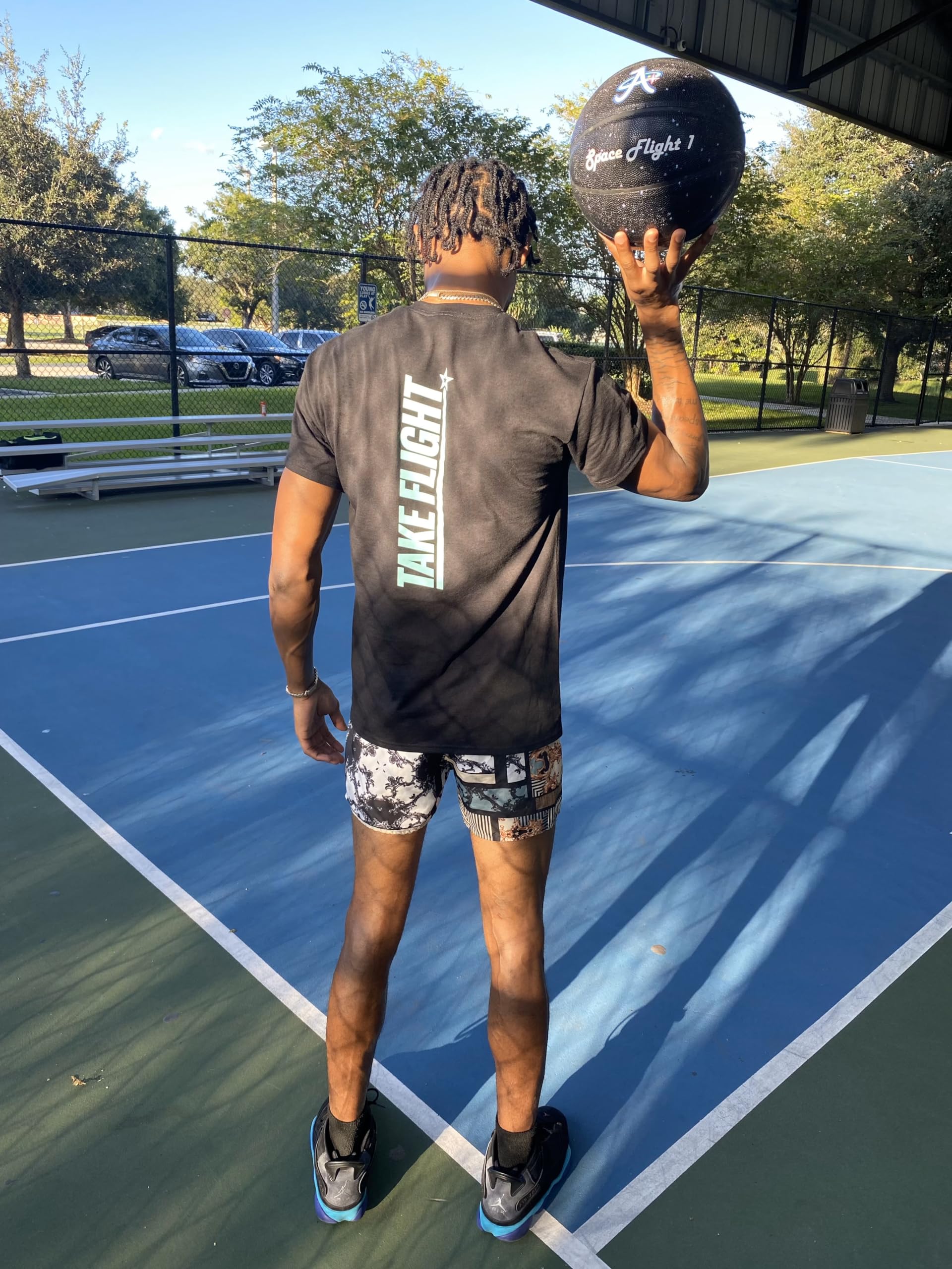 A Plus Collectibles lifestyle shot on outdoor court demonstrating rugged performance