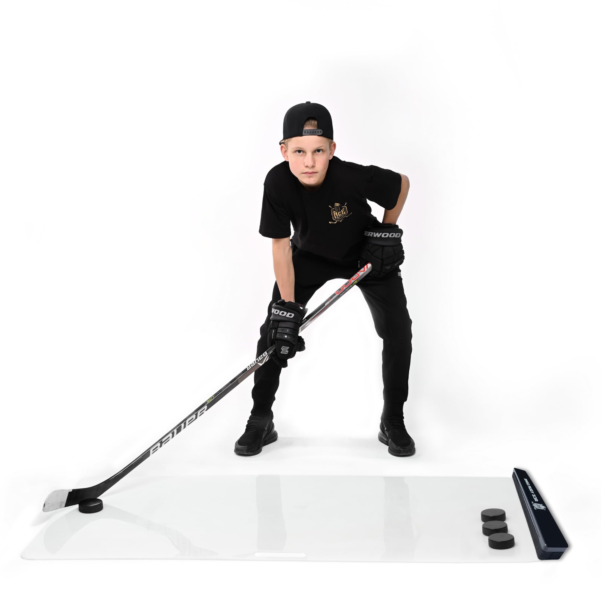 ACE HOCKEY beside hockey stick for scale benefit: compact 24-inch footprint for small spaces