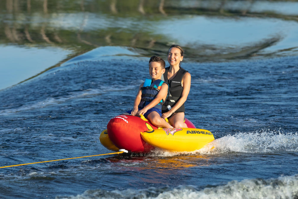 AIRHEAD Double Dog beside people for scale showing two-person capacity, clarifies size
