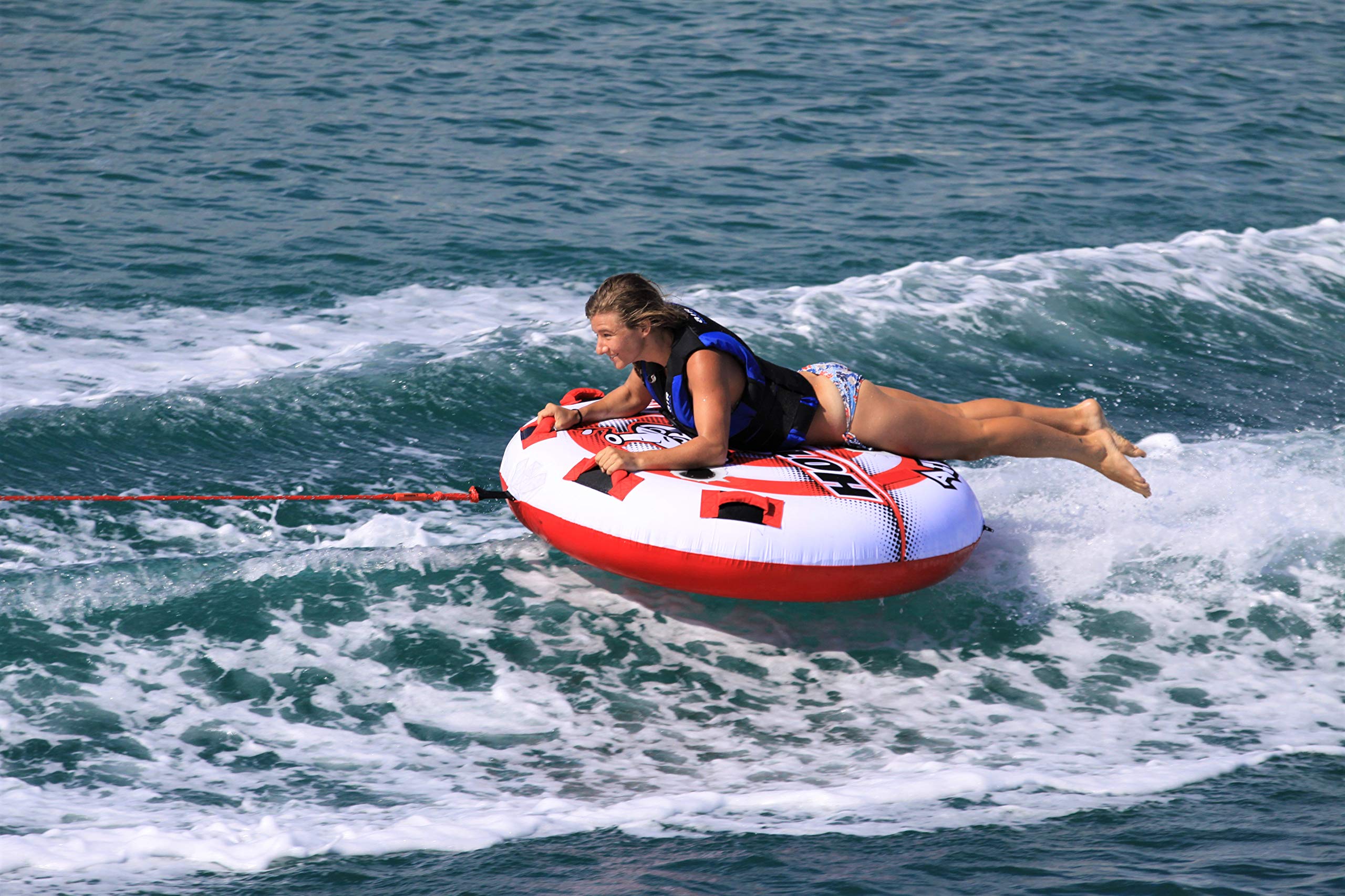 AIRHEAD Hot Shot in-water action with rider getting air time for thrilling performance