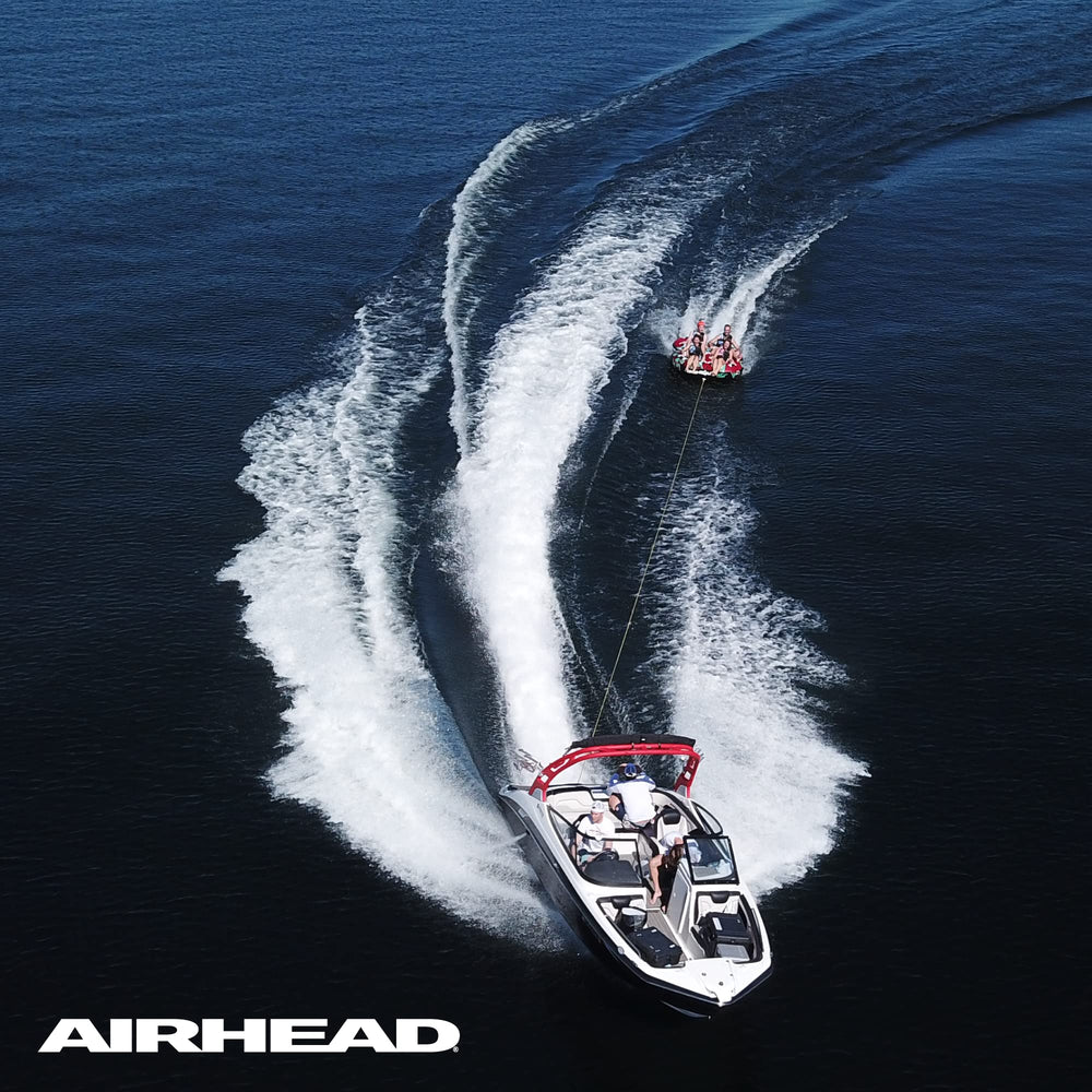 AIRHEAD tubing scene with tow rope in use, shows comfortable adjustable towing