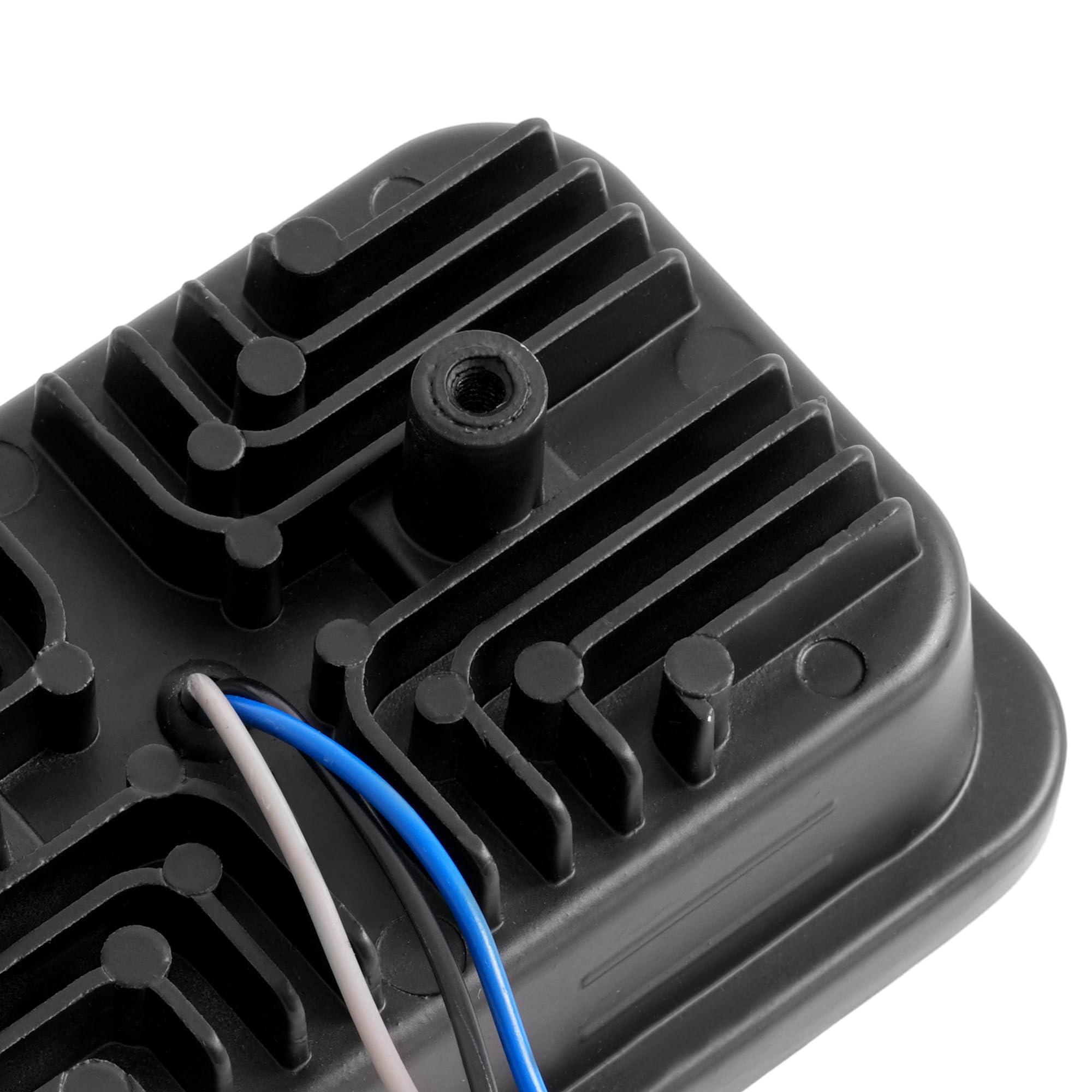 ALMULOO headlight in hand for scale showing compact size and easy replacement