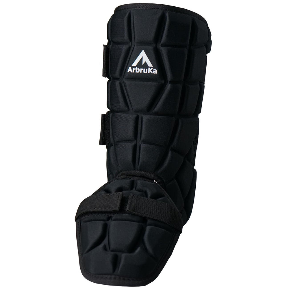 ArbruKa next to baseball cleat for scale showing lightweight compact size
