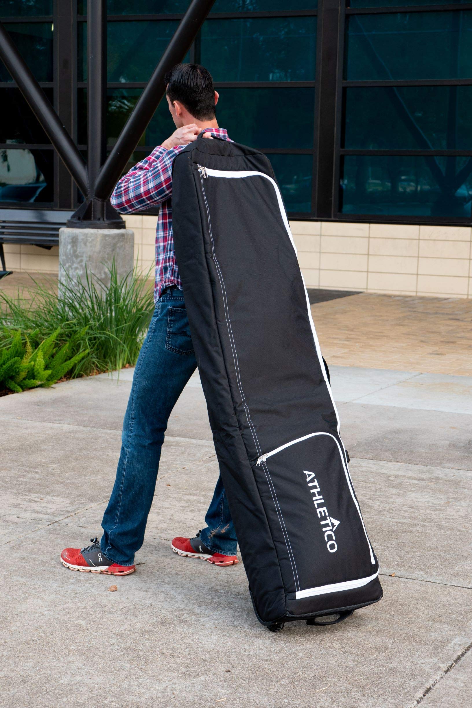 Athletico lifestyle image at airport showing wheeled bag easing travel