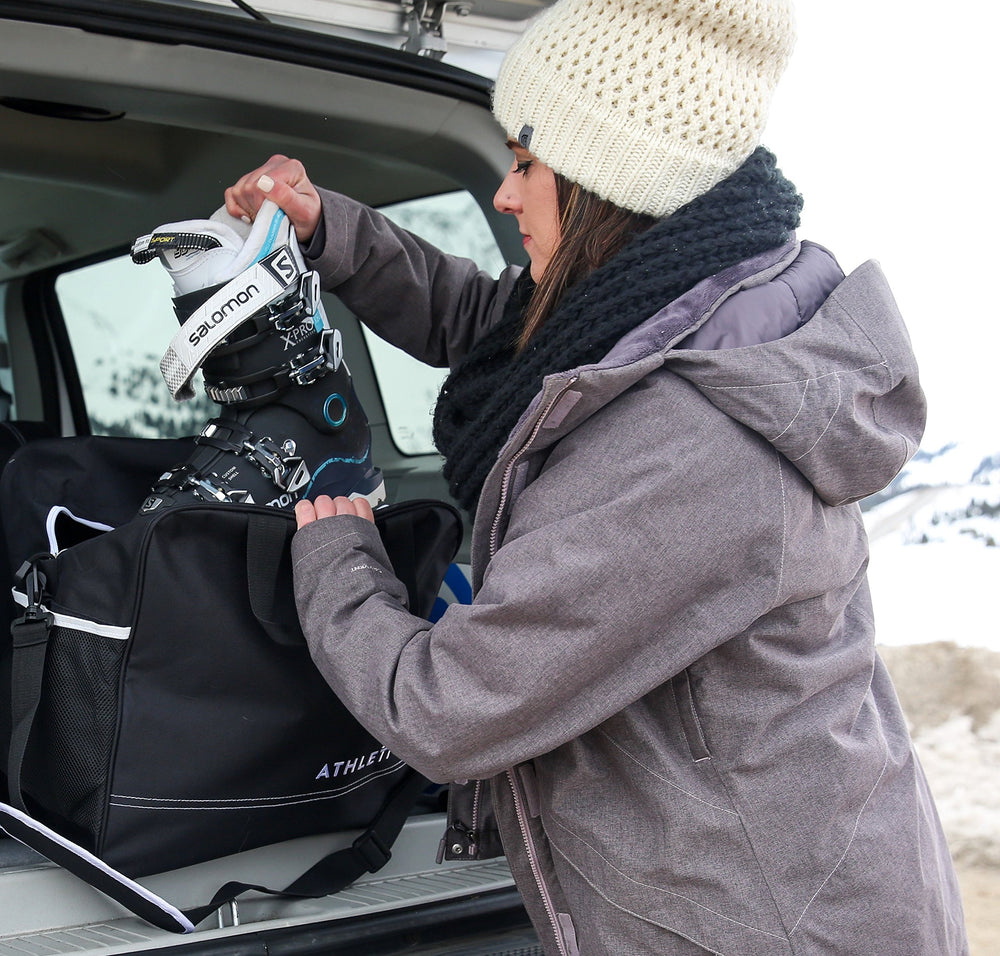 Athletico bags packed in a car trunk for efficient travel organization
