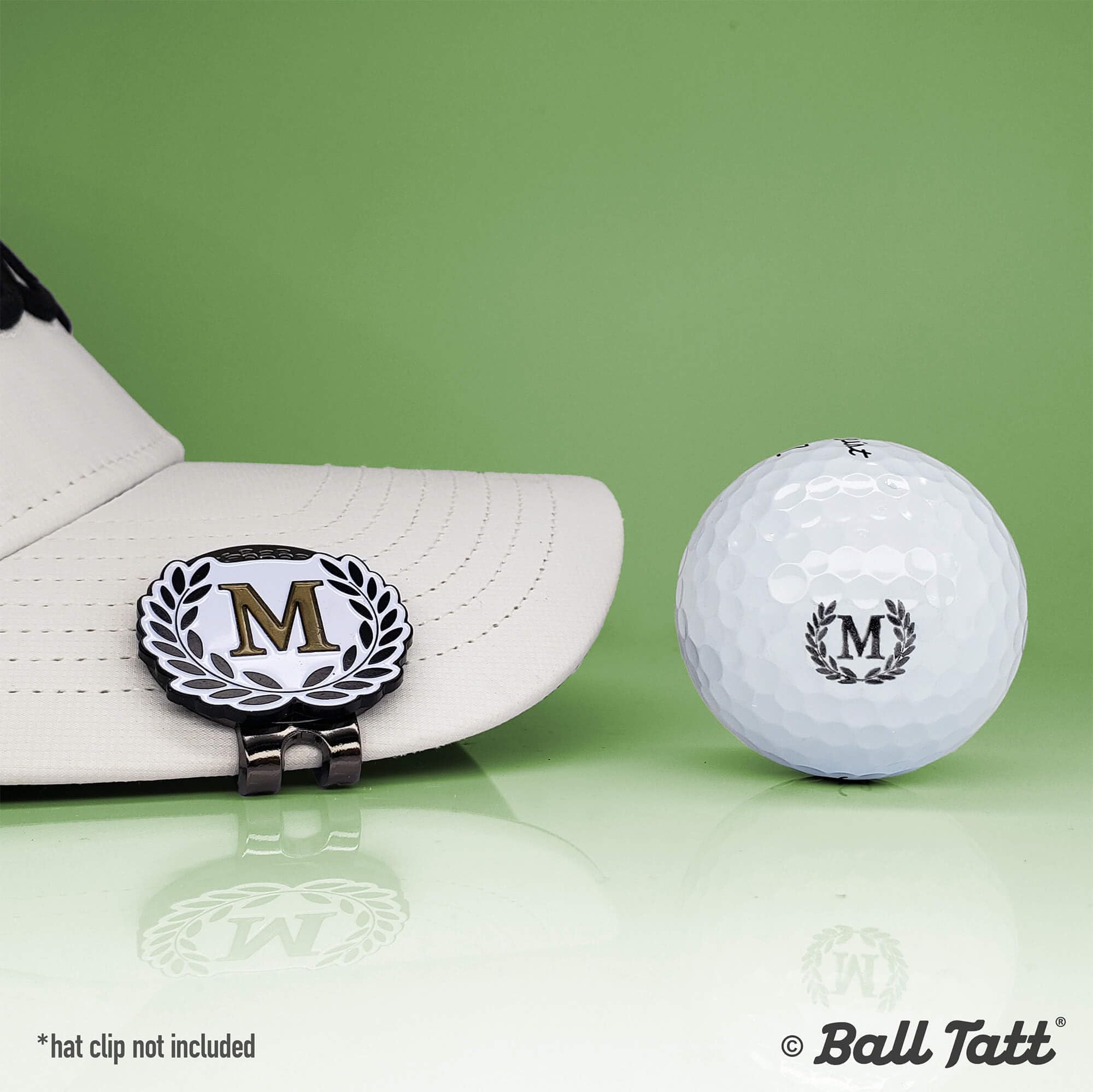 Ball Tatt close-up of the M monogram imprint demonstrating bold visibility