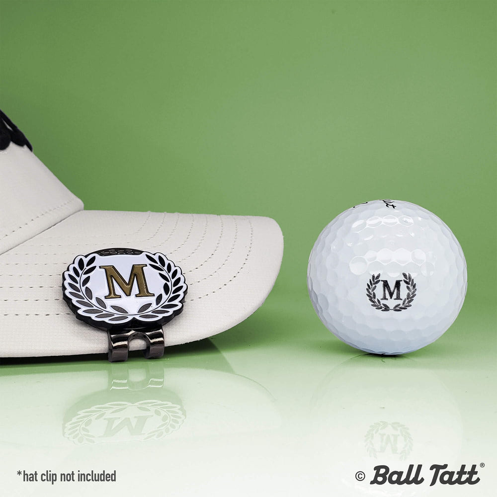 Ball Tatt close-up of the M monogram imprint demonstrating bold visibility