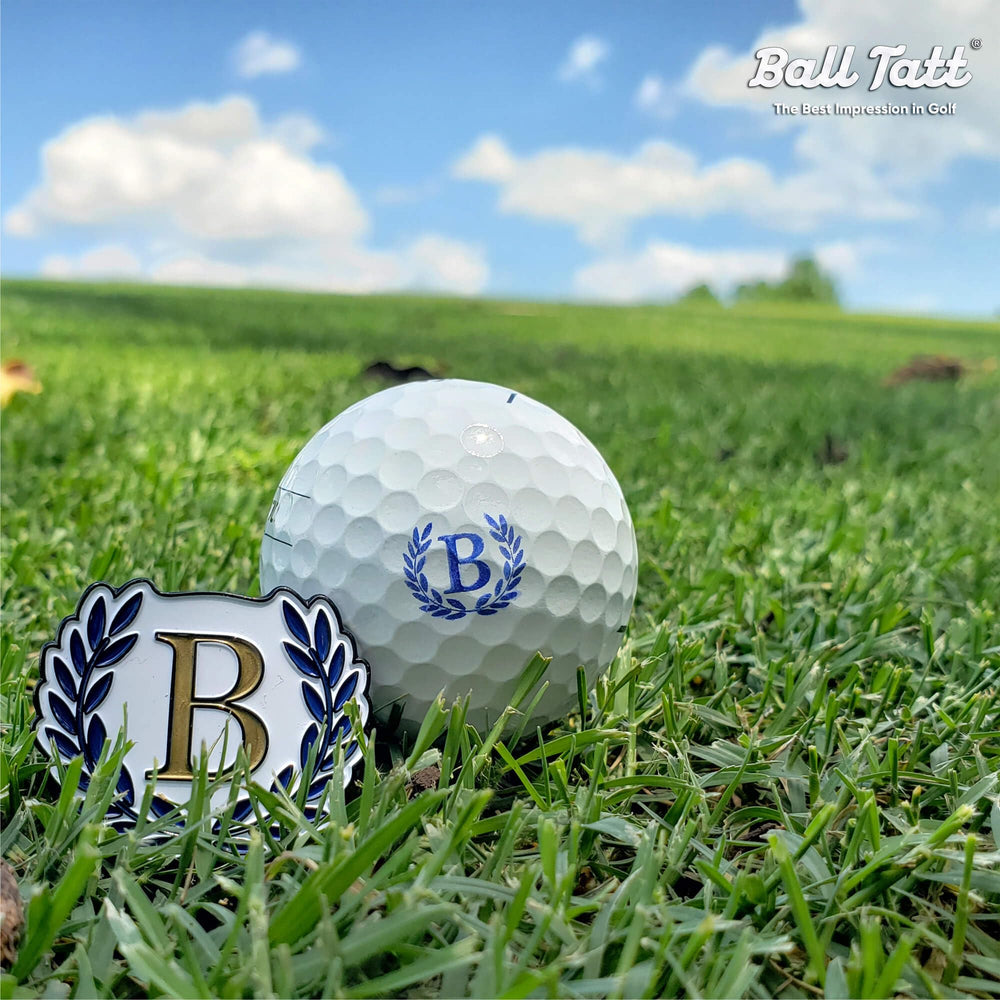 Ball Tatt stamping action on a golf ball demonstrating quick one-handed use benefit