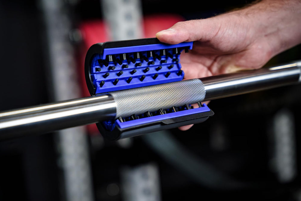 Barbell Rescue brush front view on bar showing compact design and easy handling