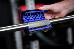 Barbell Rescue brush front view on bar showing compact design and easy handling