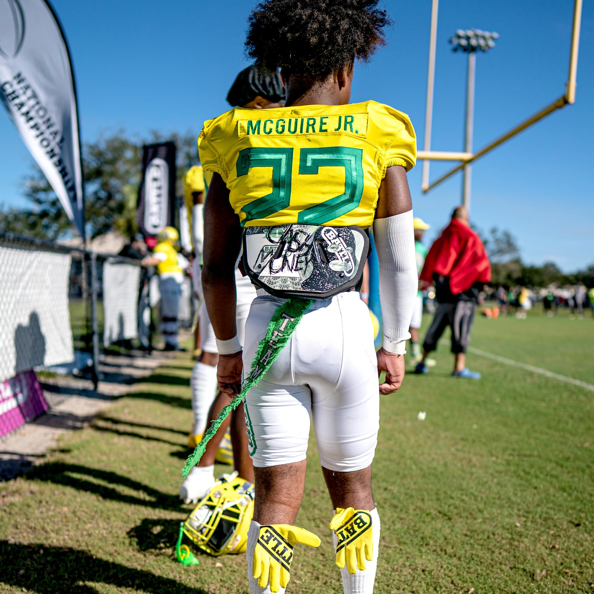 Battle back plate on grass field in lifestyle shot showing on-field style
