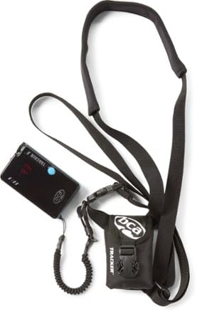 BCA beacon and probe attached to pack in backcountry setting showing compact, ready-to-use gear