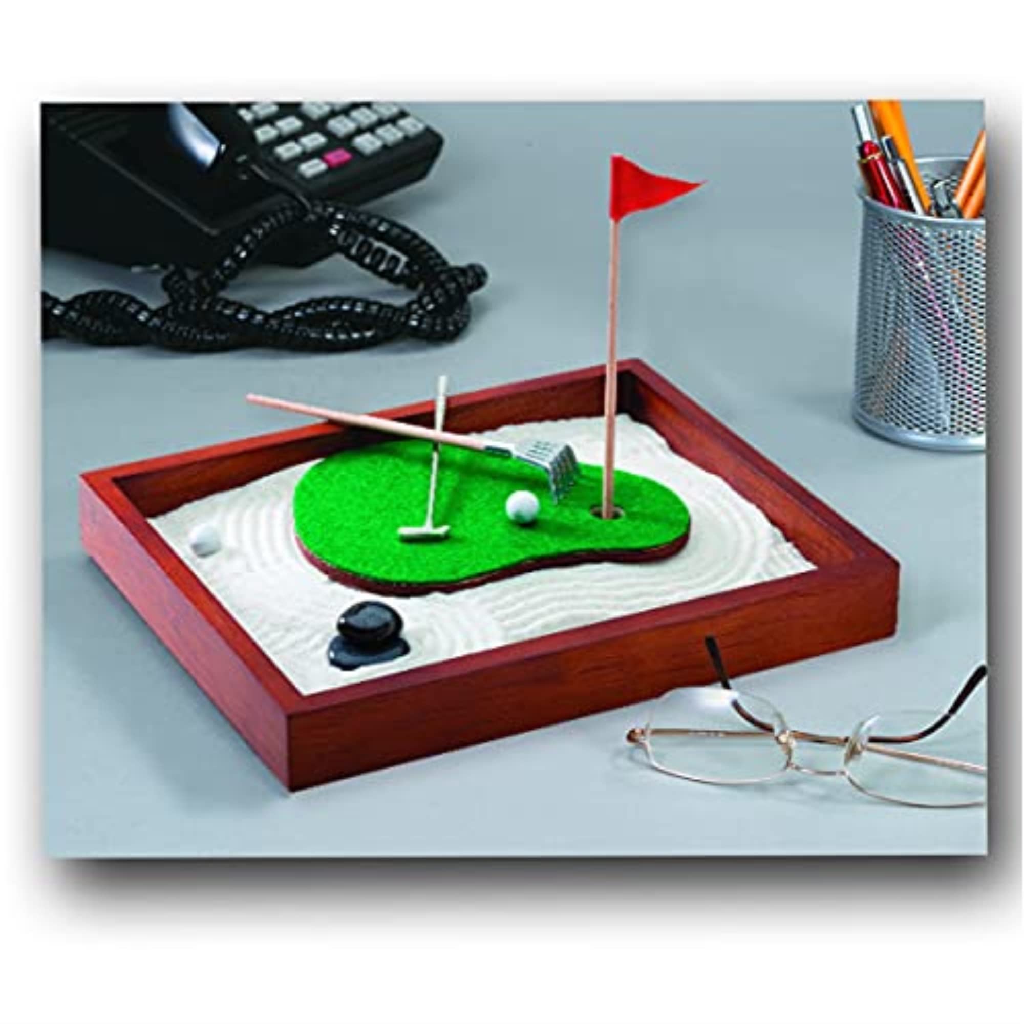 Be Good Company close-up of putter, flag, balls and rake highlighting tactile stress-relief benefits