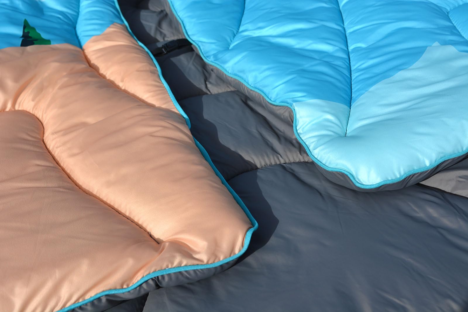 Bedvcaty blanket laid on beach sand protecting from dampness and mess