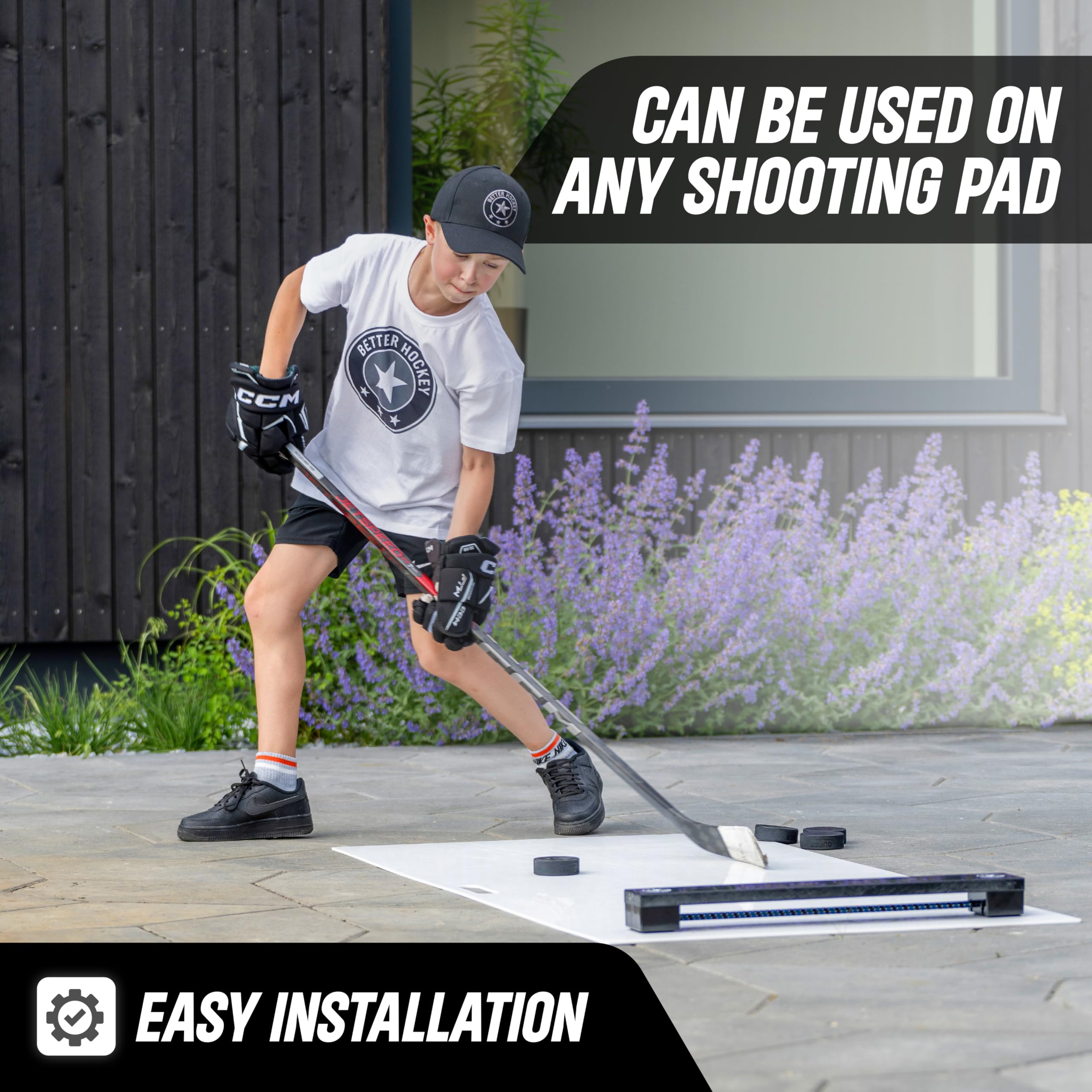 Better Hockey rebounder in garage practice setup enabling solo shooting and one-timers