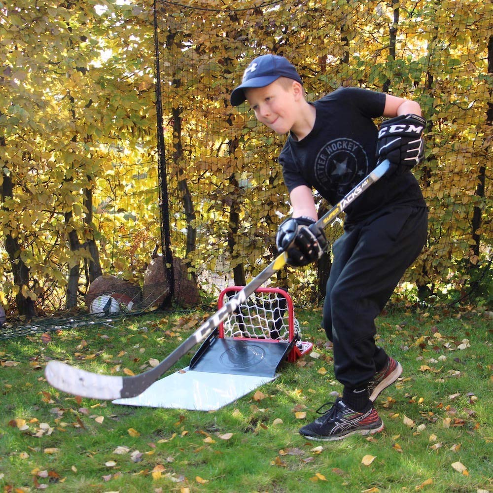 Better Hockey player practicing saucer pass on street showcasing convenient on-the-go training